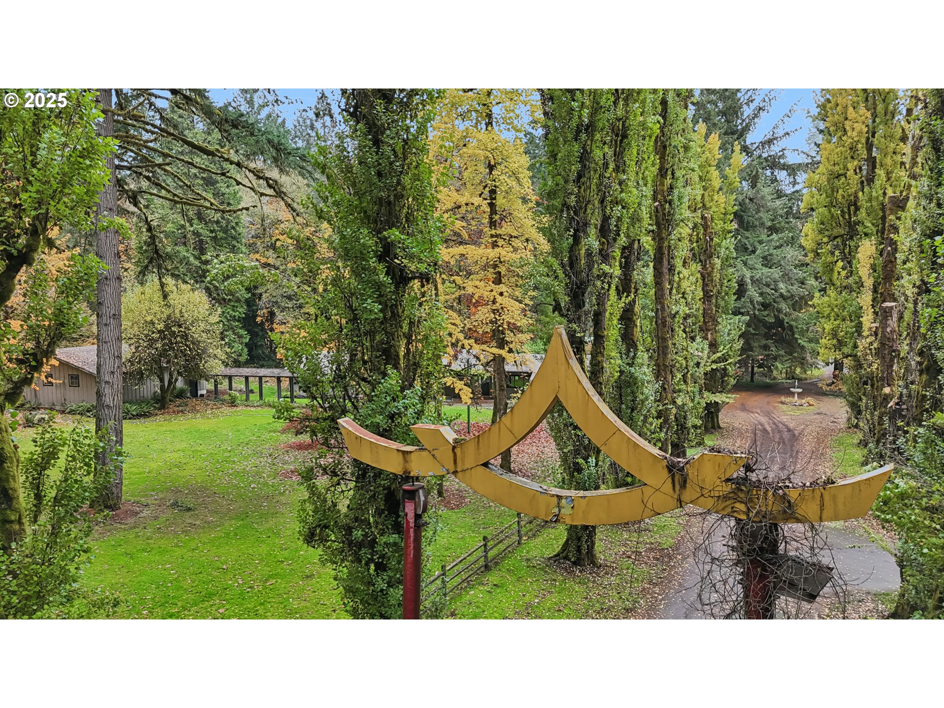39777 Northwest Murtaugh Road North Plains, OR 97133 - Photo 37 of 45 a backyard of a house with outdoor seating and trees