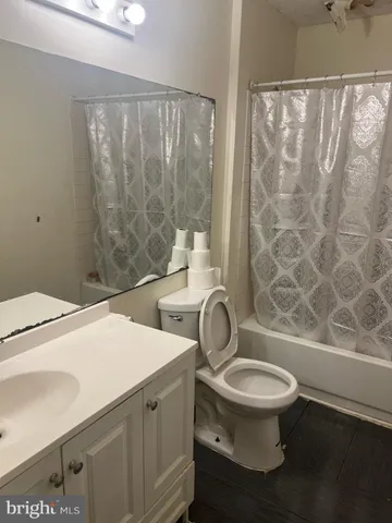 a bathroom with a toilet a sink and a shower