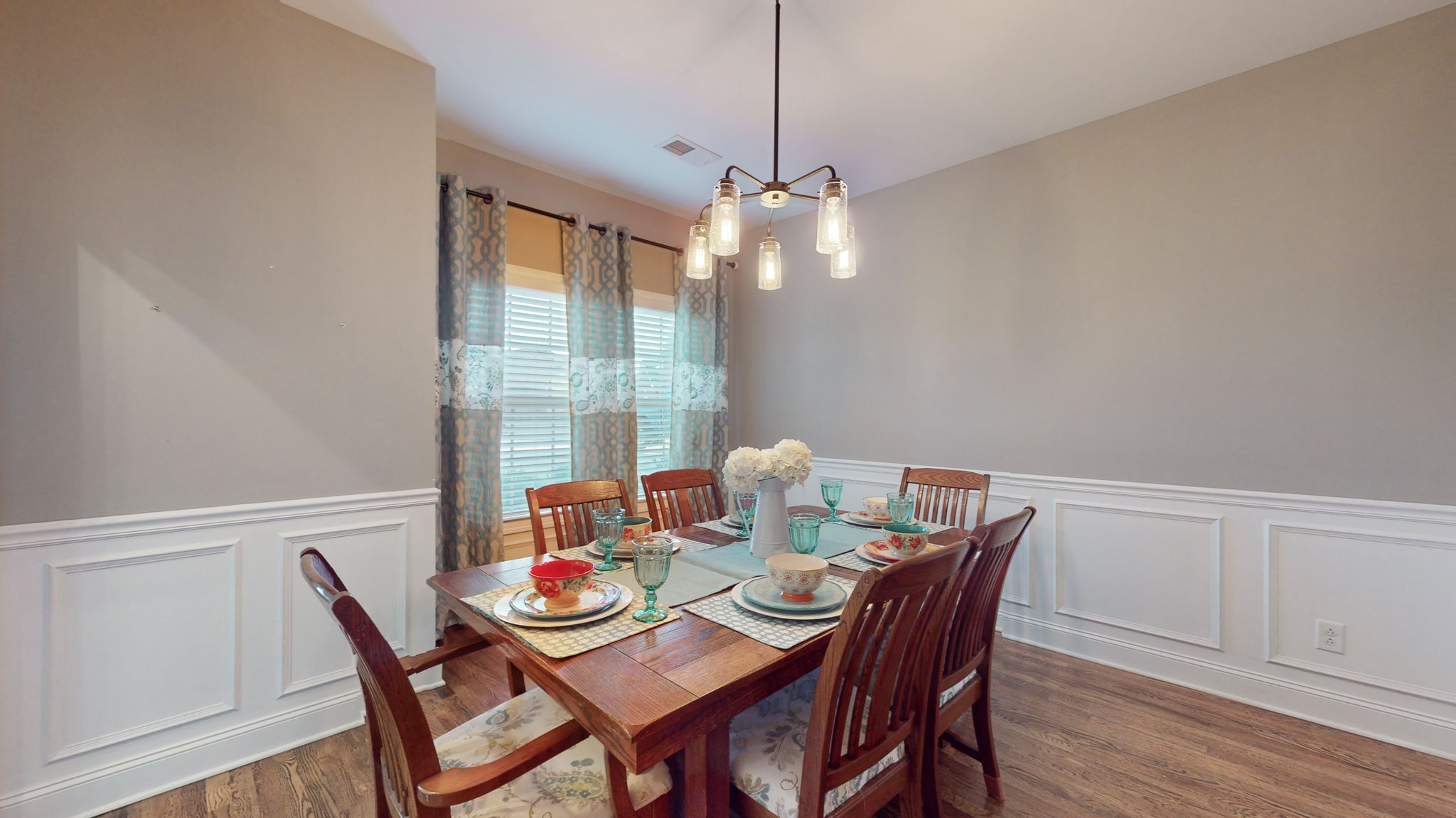 306 Patsy Place Smyrna, TN 37167 - Photo 13 of 34 a dining room with furniture a chandelier and wooden floor