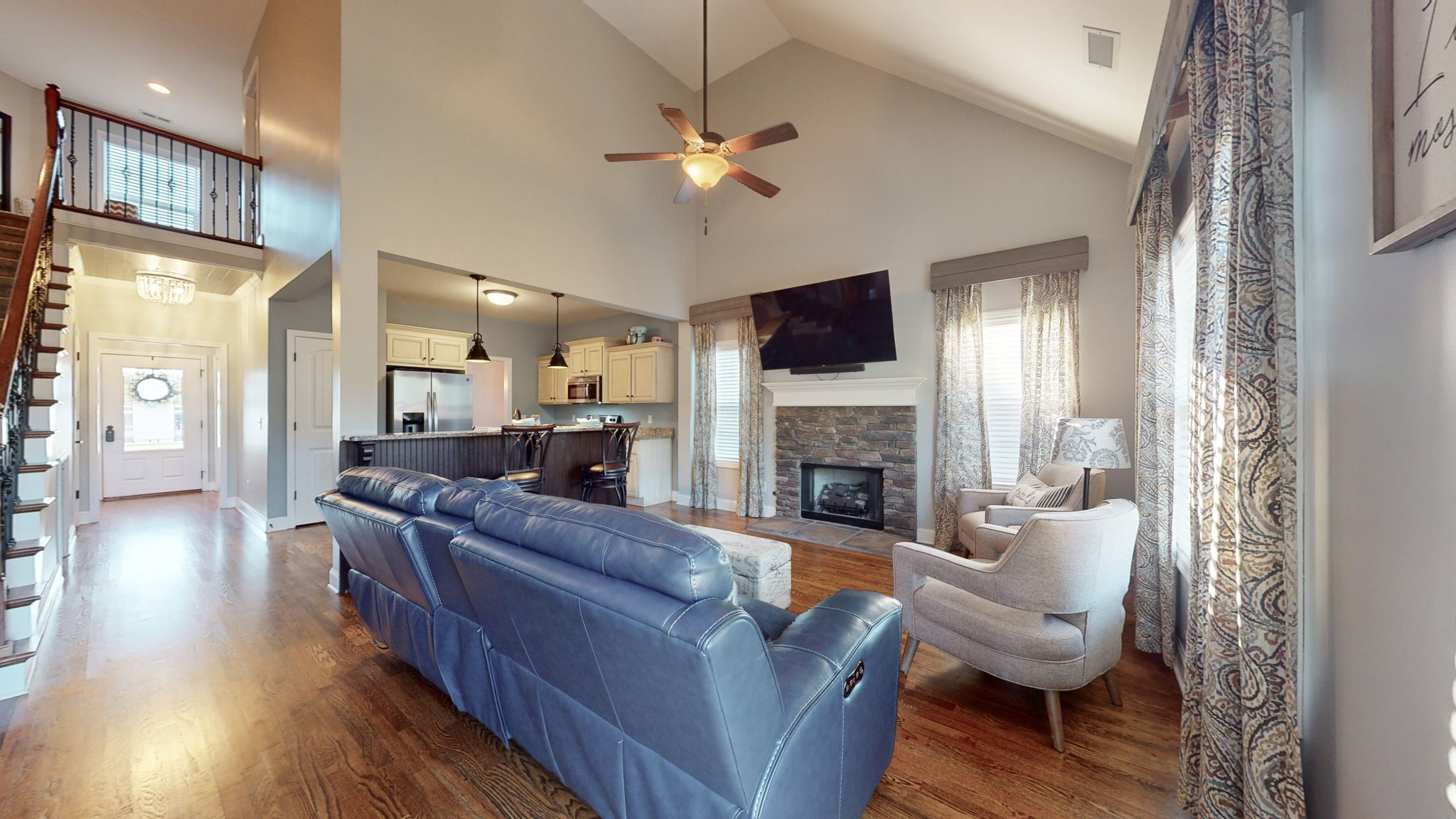 306 Patsy Place Smyrna, TN 37167 - Photo 4 of 34 a living room with furniture a fireplace and a chandelier