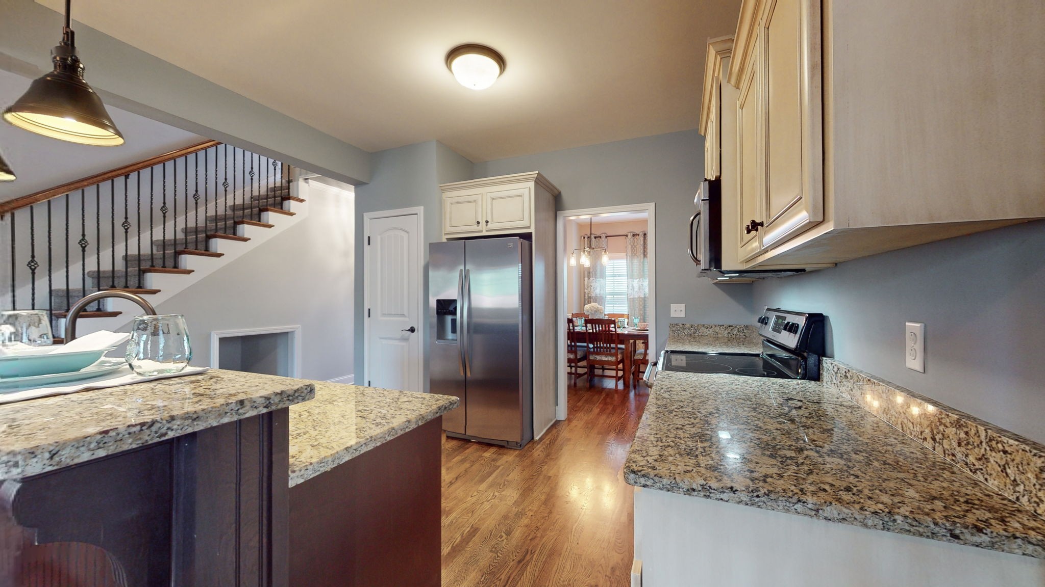306 Patsy Place Smyrna, TN 37167 - Photo 9 of 34 a kitchen with granite countertop a sink a stove and cabinets