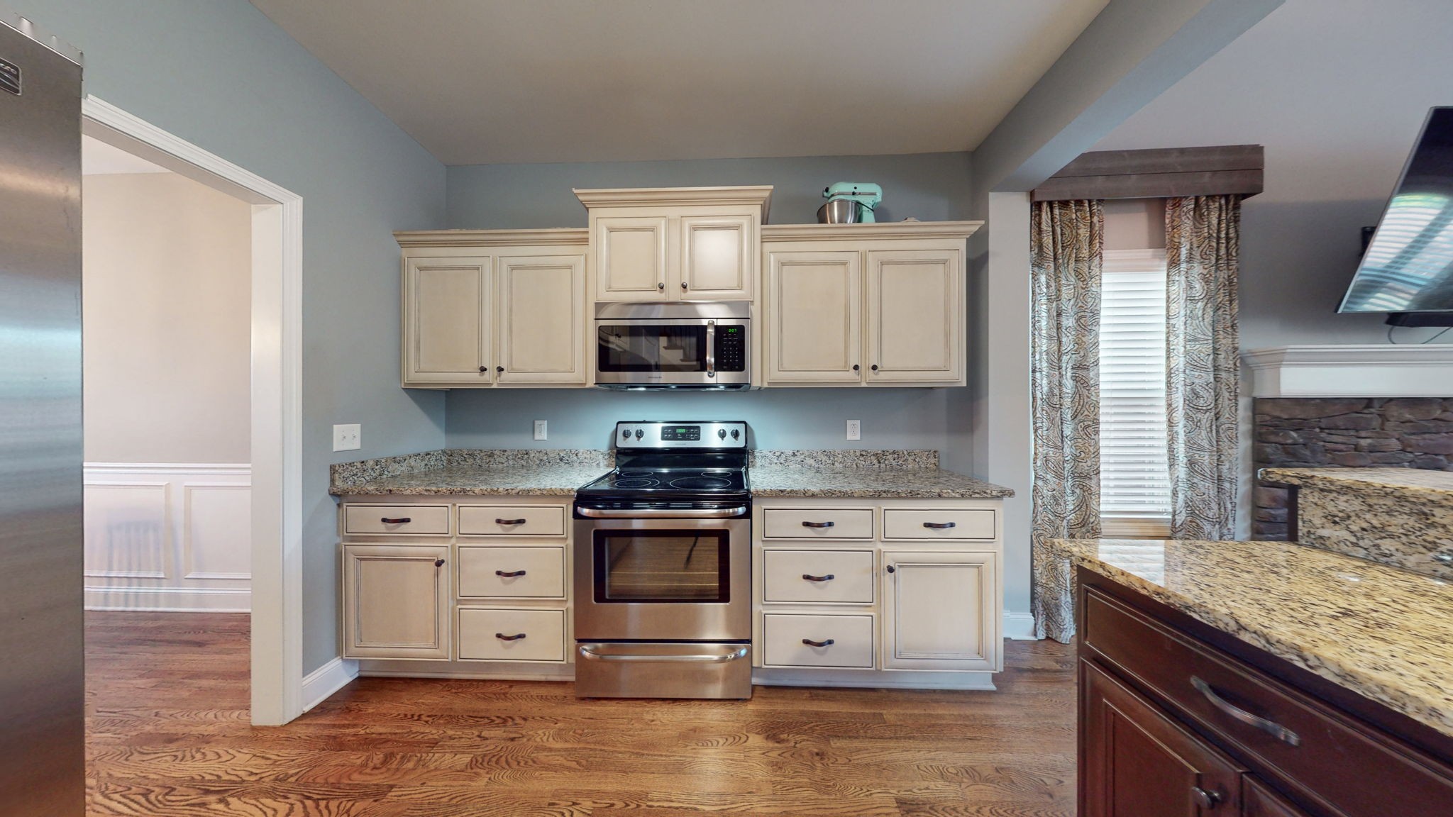 306 Patsy Place Smyrna, TN 37167 - Photo 10 of 34 a kitchen with stainless steel appliances granite countertop a stove a sink and a refrigerator