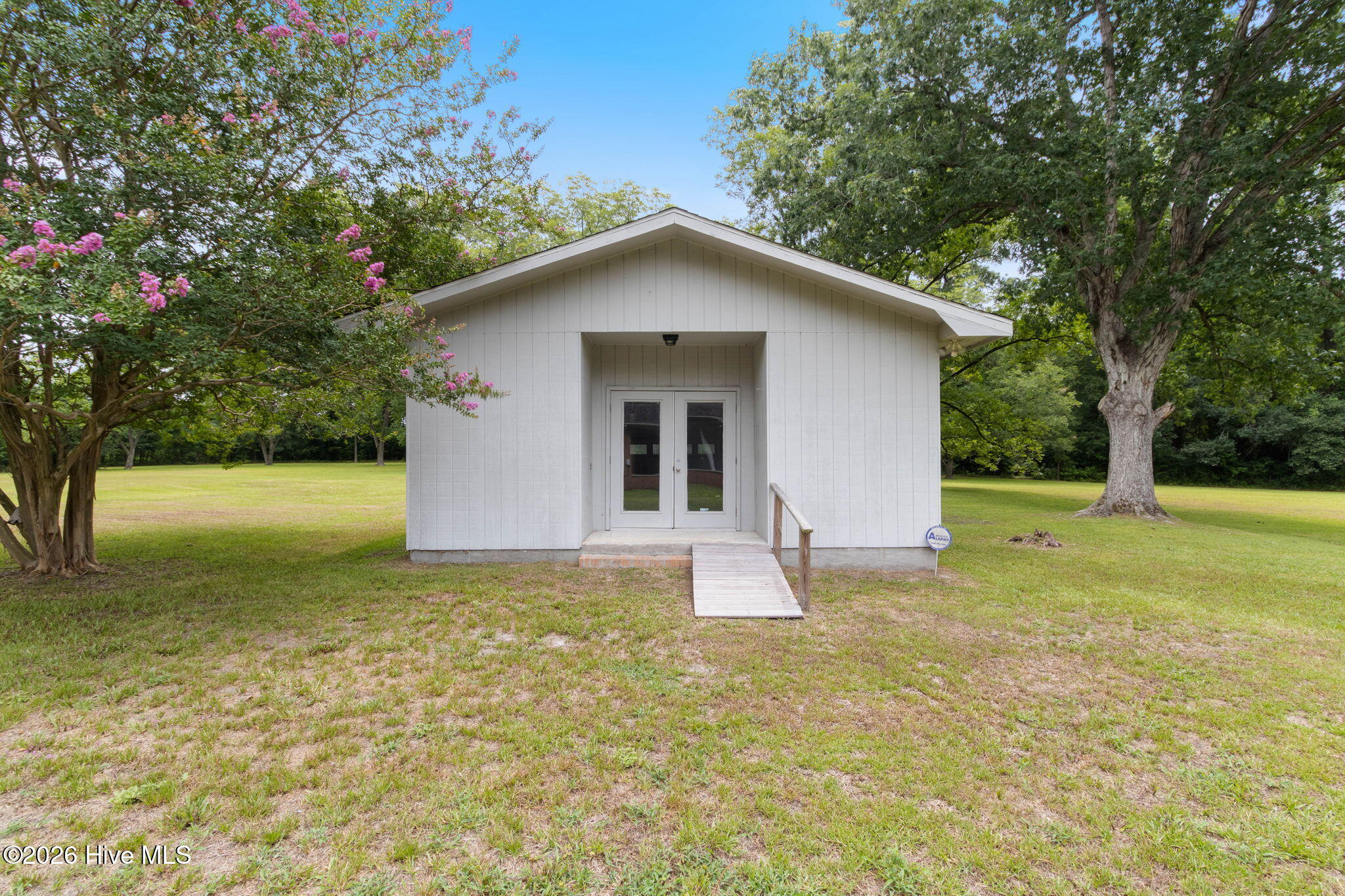 312 North Mitchell Ford Road Clarkton, NC 28433 - Photo 2 of 46 With French Doors and Garage Door