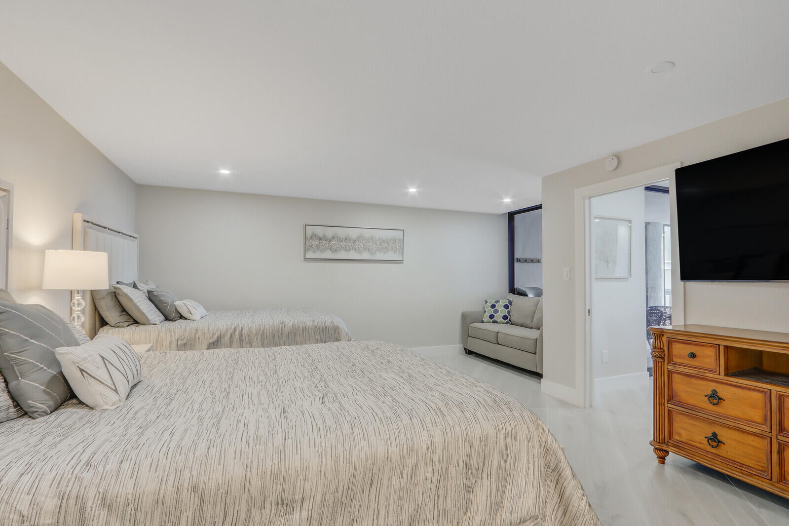 5380 North Ocean Drive, Unit 9A Singer Island, FL 33404 - Photo 22 of 38 a bedroom with a bed and a television