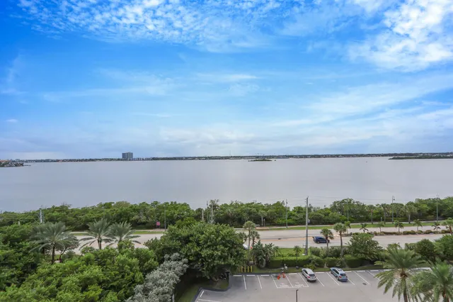 a view of a lake with houses in the back