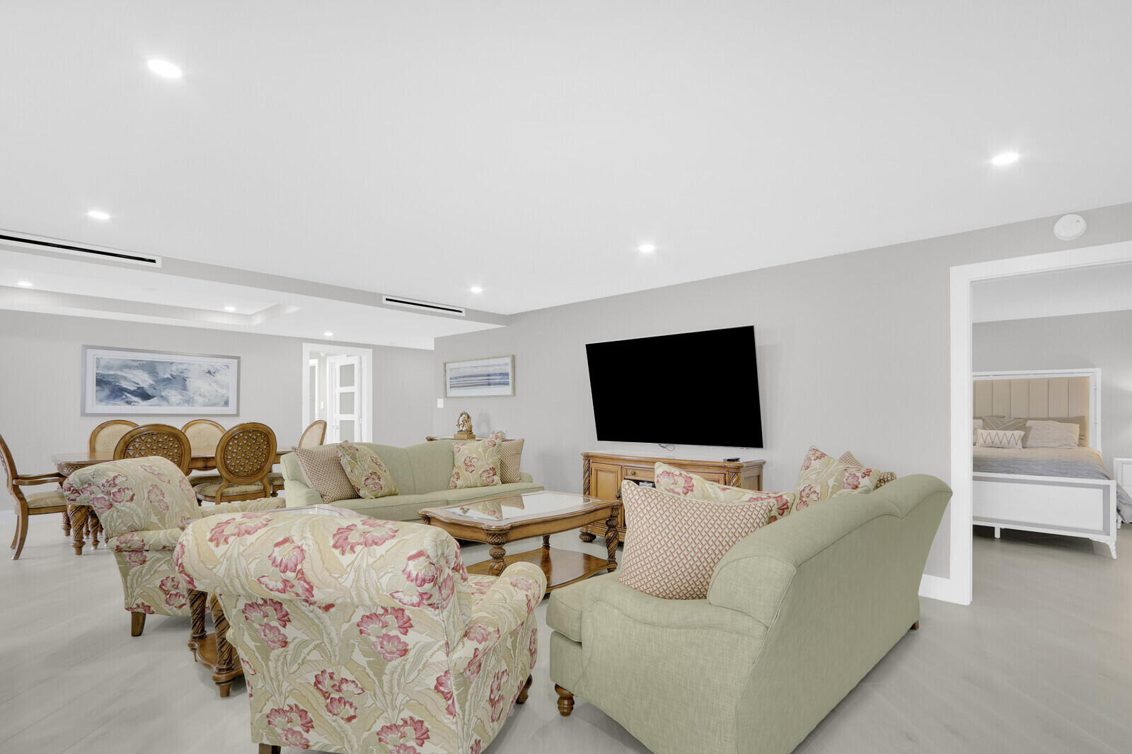 5380 North Ocean Drive, Unit 9A Singer Island, FL 33404 - Photo 10 of 38 a living room with furniture and a flat screen tv