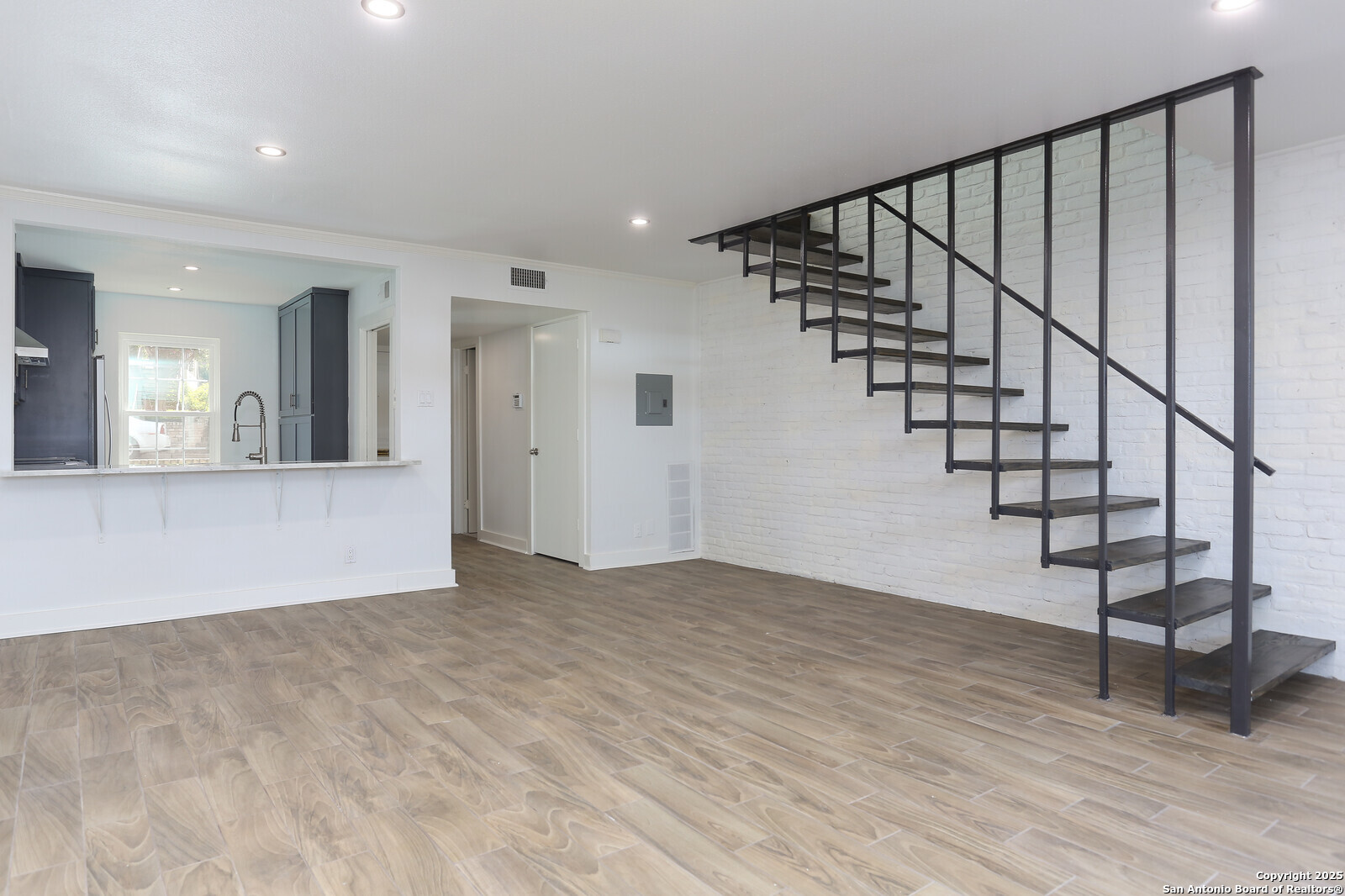 112 Ruelle Lane, Unit 112 San Antonio, TX 78209 - Photo 2 of 16 a view of an entryway with wooden floor