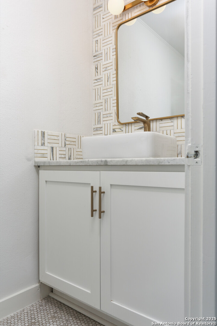 112 Ruelle Lane, Unit 112 San Antonio, TX 78209 - Photo 7 of 16 a bathroom with a sink and a mirror
