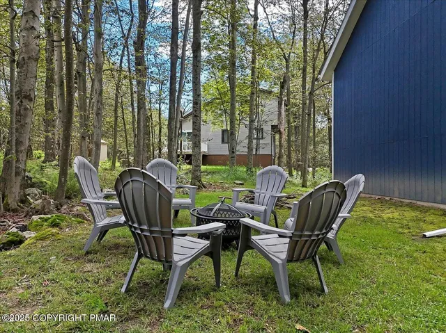 a view of a chairs and table in patio
