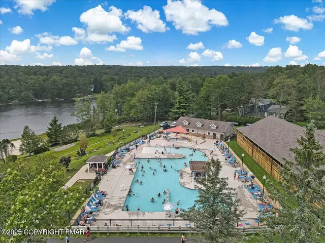 an aerial view of a house with a garden