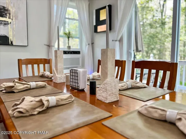 a living room with furniture and a table