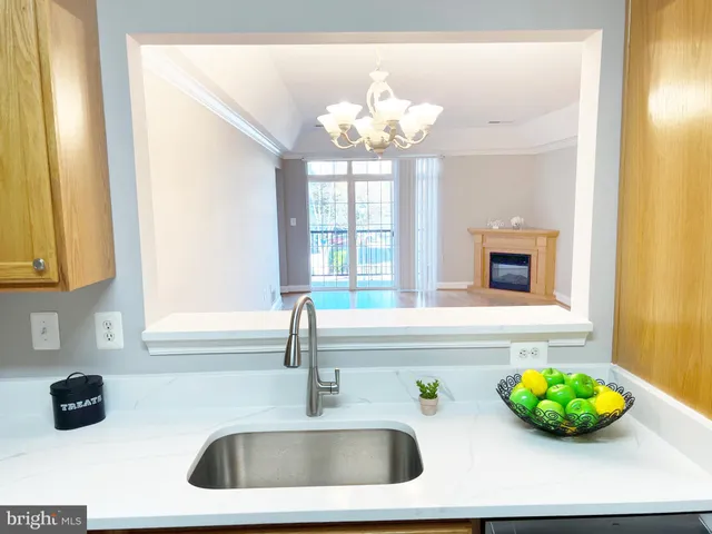 a kitchen with a sink and a window