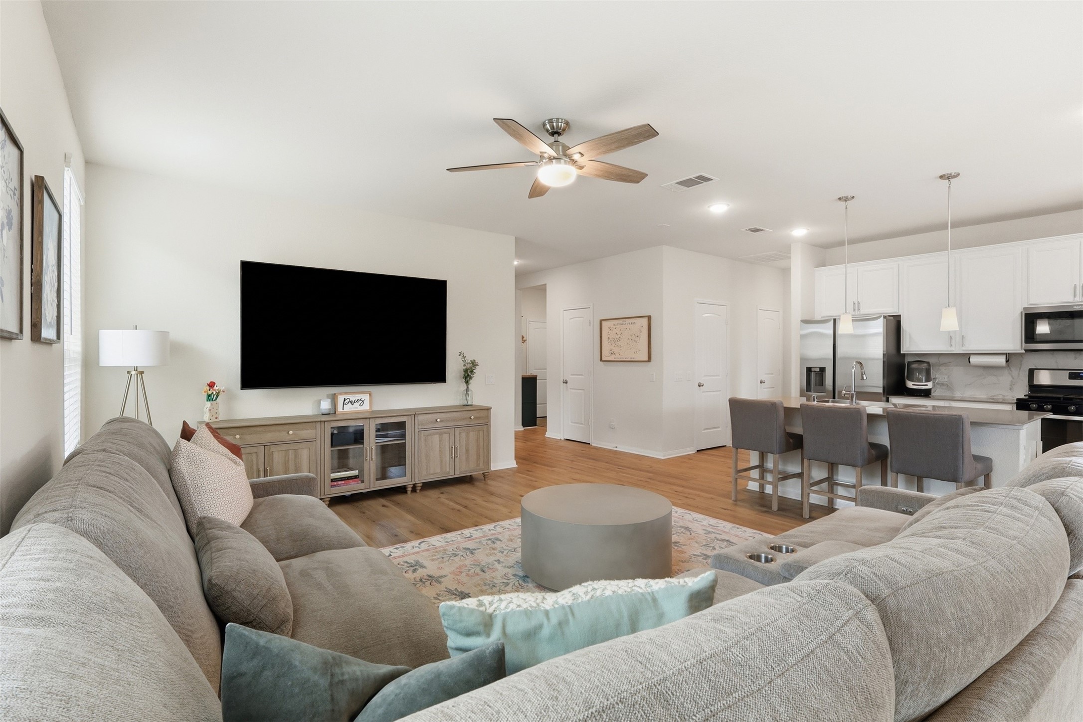 9739 Birdsnest Court Spring, TX 77379 - Photo 9 of 38 Spacious family room filled with natural light and seamless flow into the kitchen.