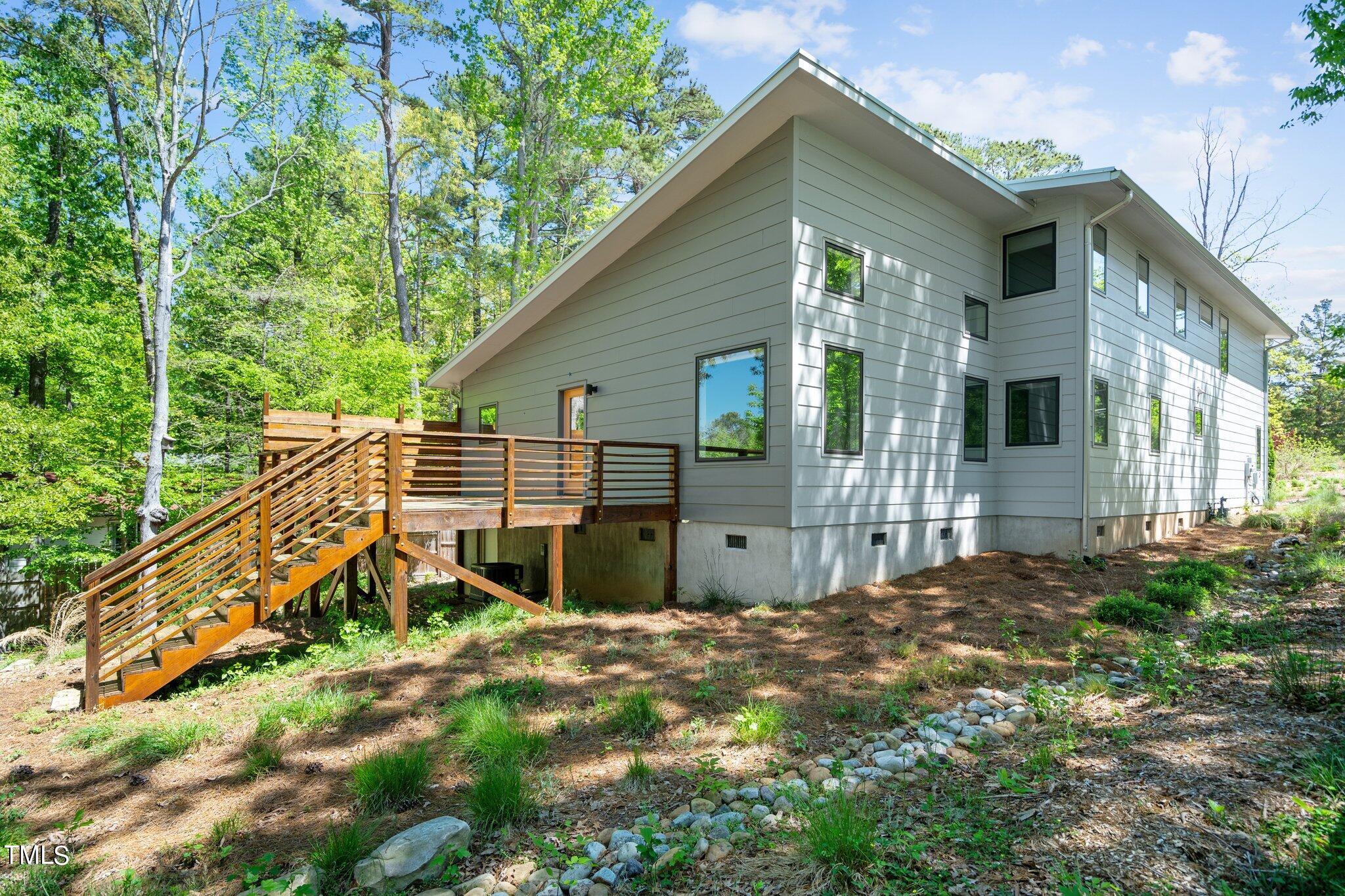 3546 Dixon Road Durham, NC 27707 - Photo 14 of 16 The private large deck overlooks the expansive backyard.