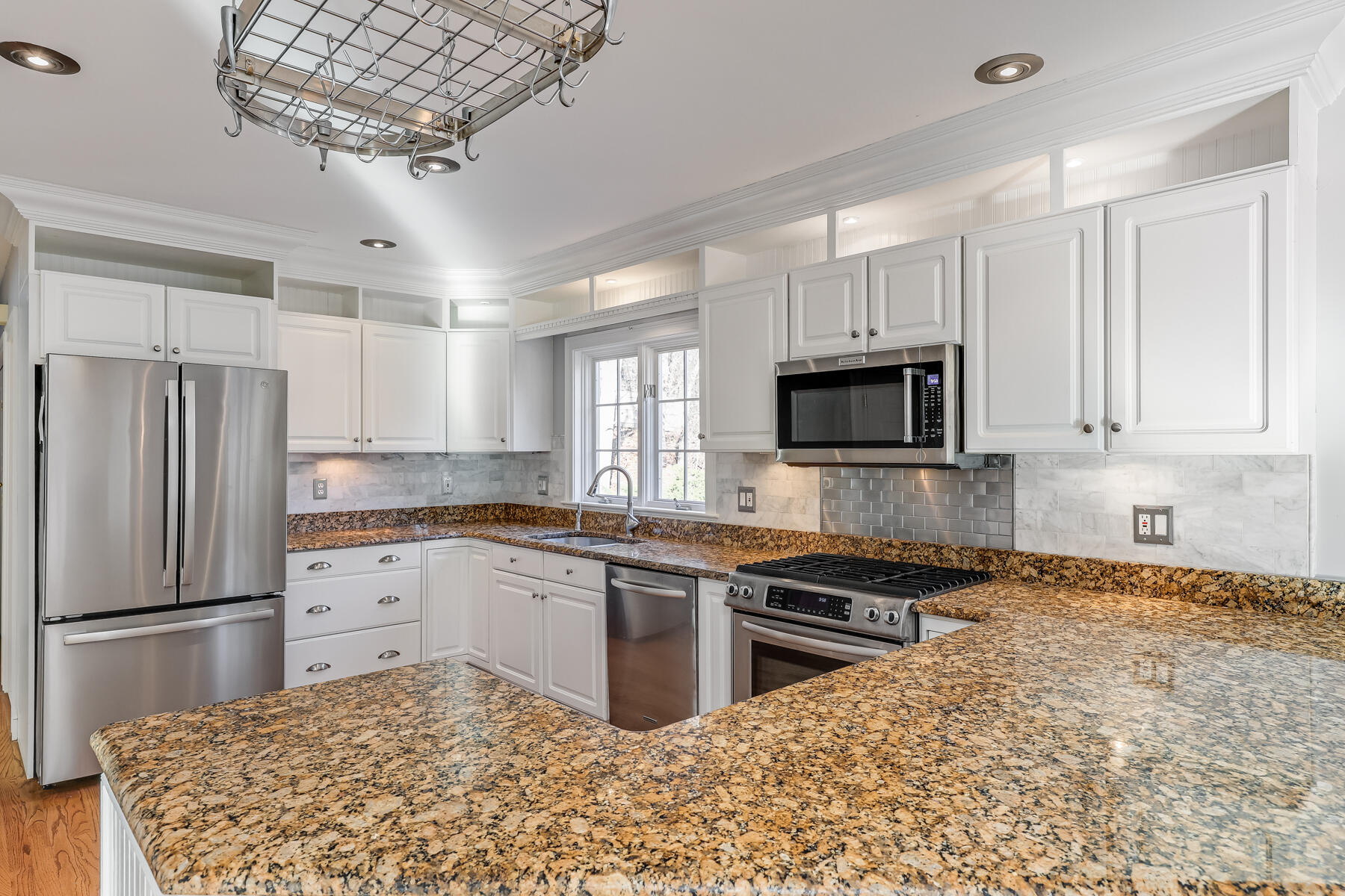 683 Mistic Drive Marstons Mills, MA 02648 - Photo 19 of 50 a kitchen with stainless steel appliances granite countertop a stove sink and microwave