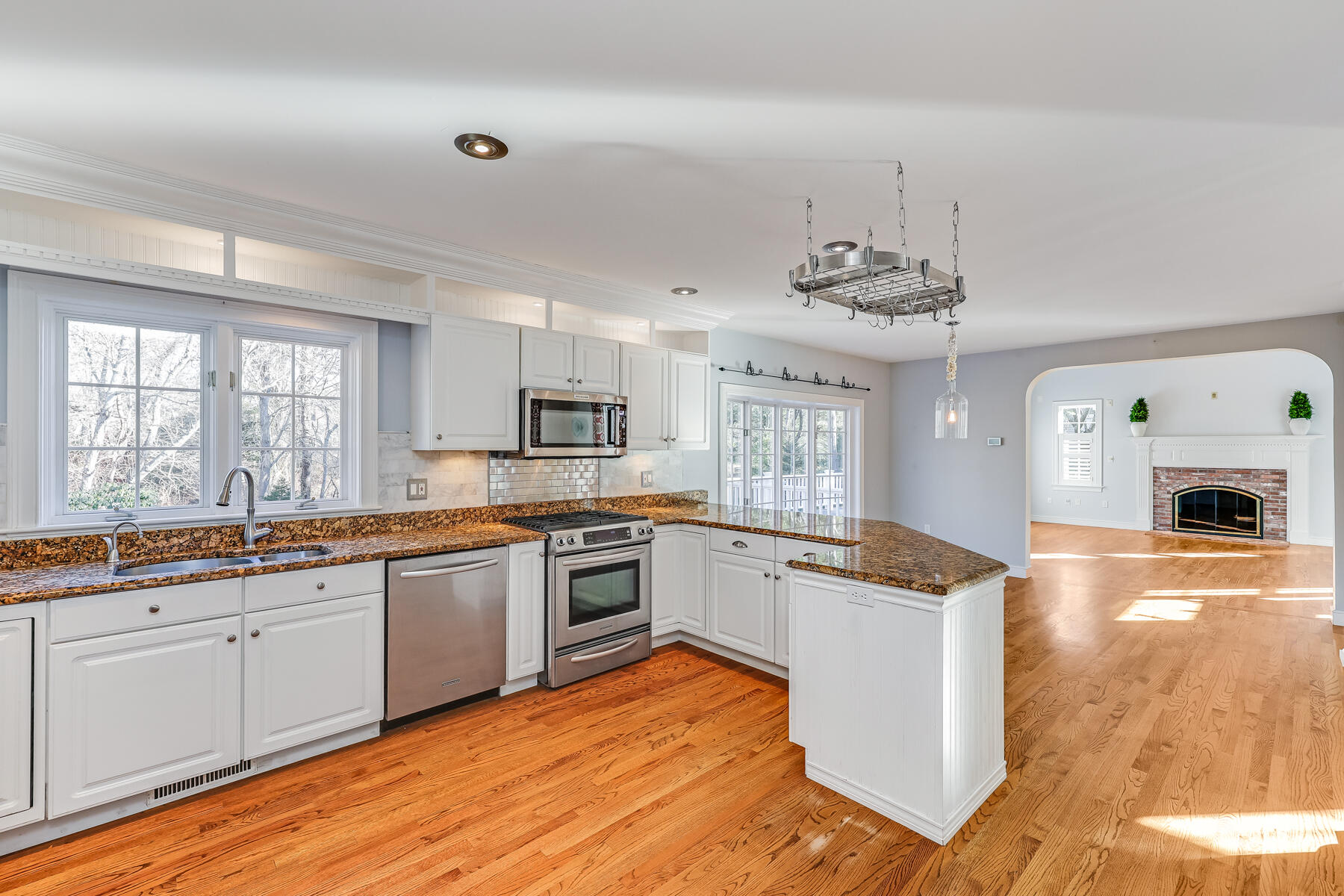 683 Mistic Drive Marstons Mills, MA 02648 - Photo 20 of 50 a large kitchen with stainless steel appliances granite countertop a sink and cabinets