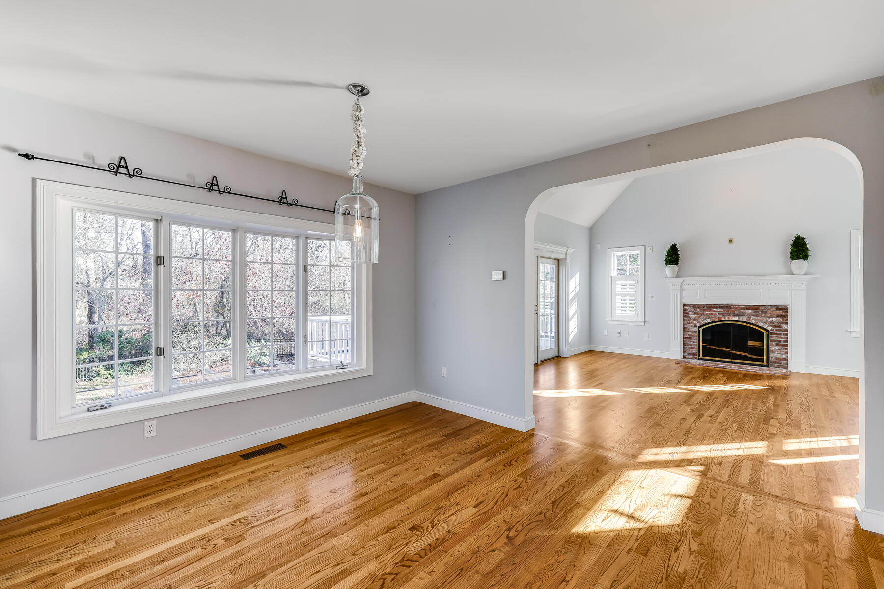 683 Mistic Drive Marstons Mills, MA 02648 - Photo 21 of 50 a view of empty room with wooden floor and fan
