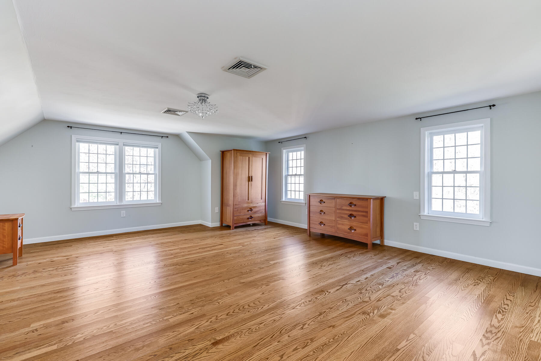 683 Mistic Drive Marstons Mills, MA 02648 - Photo 29 of 50 an empty room with wooden floor and windows