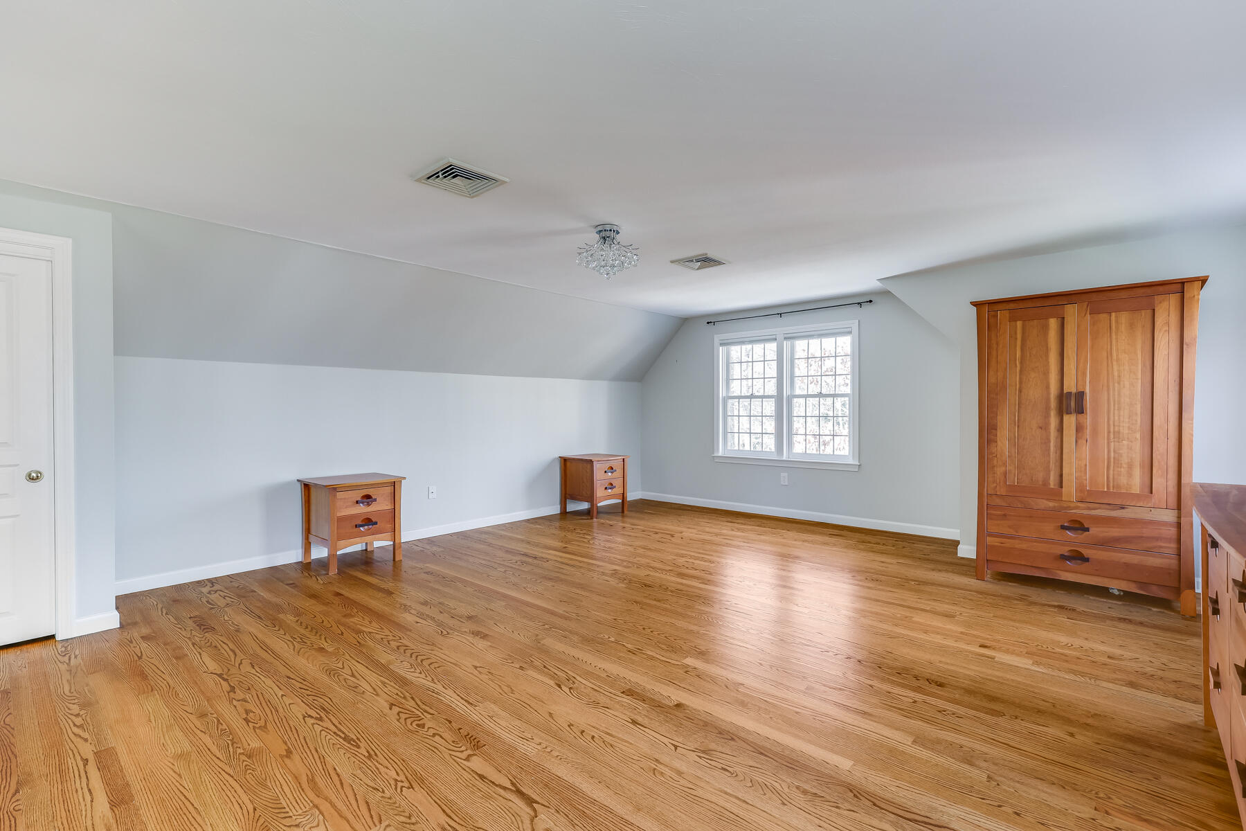 683 Mistic Drive Marstons Mills, MA 02648 - Photo 30 of 50 a view of room with window and wooden floor