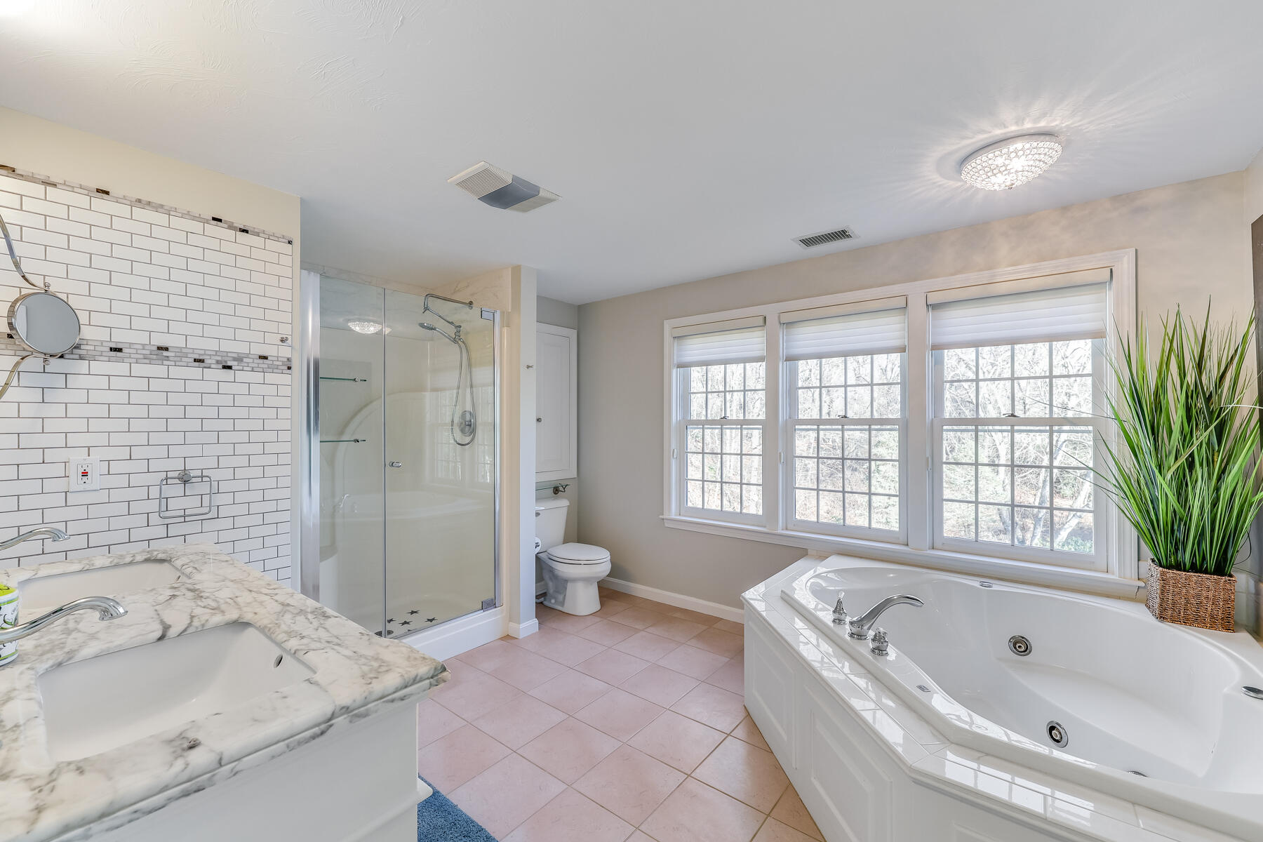 683 Mistic Drive Marstons Mills, MA 02648 - Photo 31 of 50 a spacious bathroom with a tub sink shower and two mirror