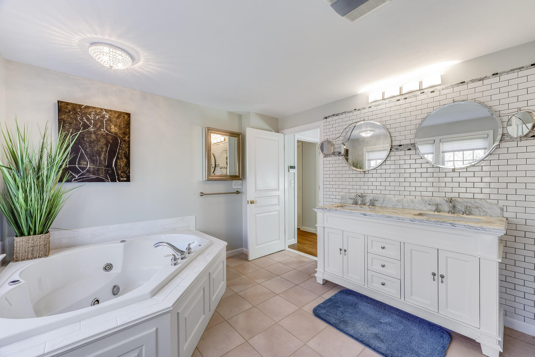 683 Mistic Drive Marstons Mills, MA 02648 - Photo 34 of 50 a bathroom with a tub sink and mirror