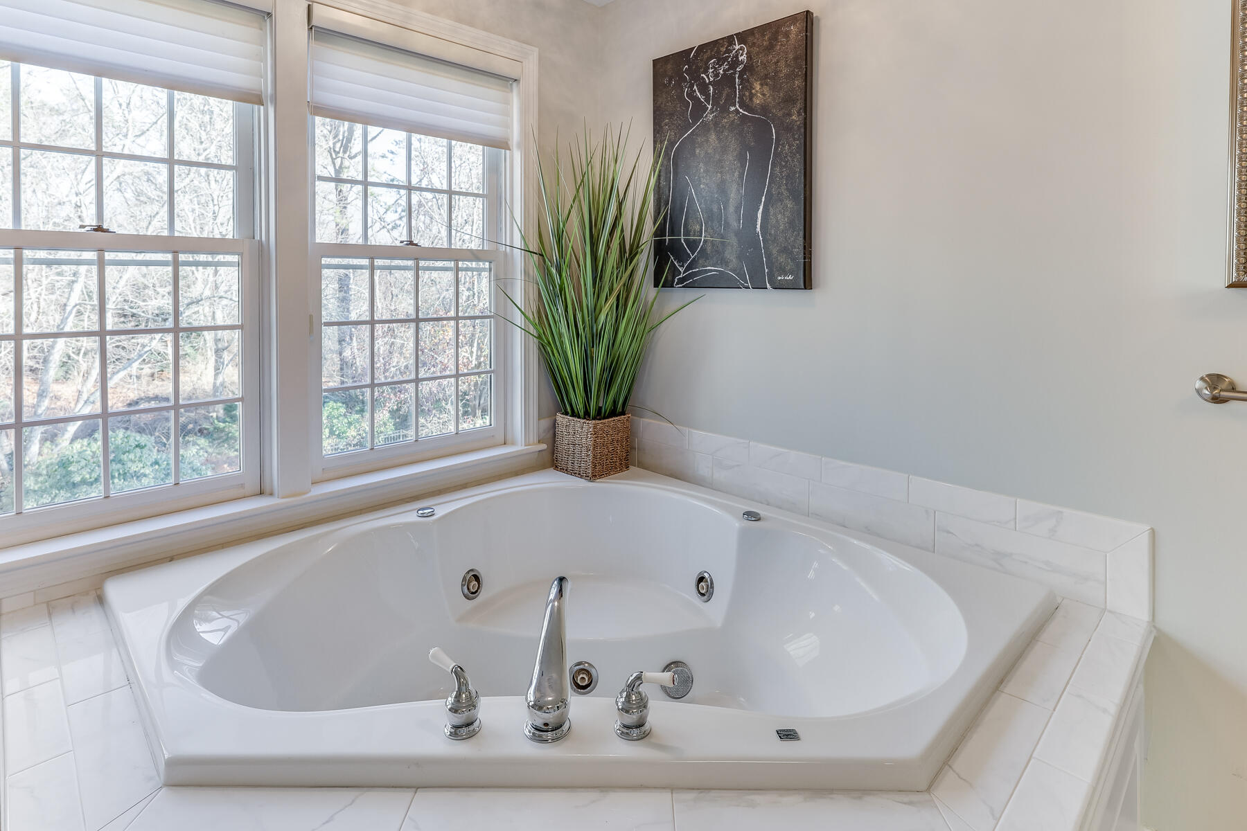 683 Mistic Drive Marstons Mills, MA 02648 - Photo 35 of 50 a white bath tub sitting in a bathroom next to a window