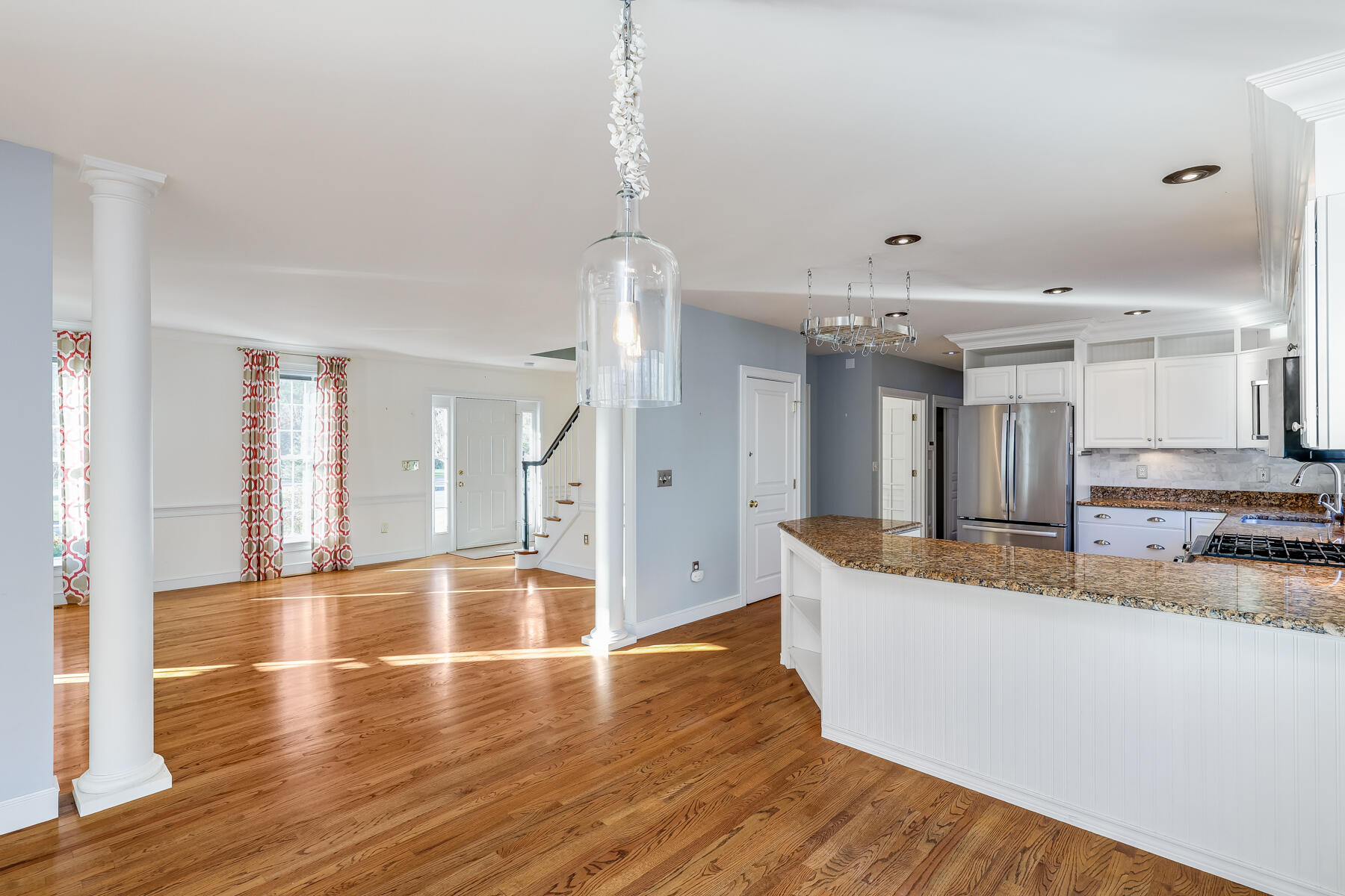 683 Mistic Drive Marstons Mills, MA 02648 - Photo 44 of 50 a large kitchen with stainless steel appliances kitchen island a large counter top and a wooden floors