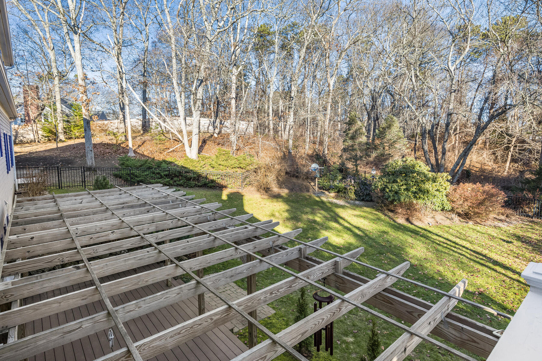 683 Mistic Drive Marstons Mills, MA 02648 - Photo 49 of 50 a backyard of a house with a trees