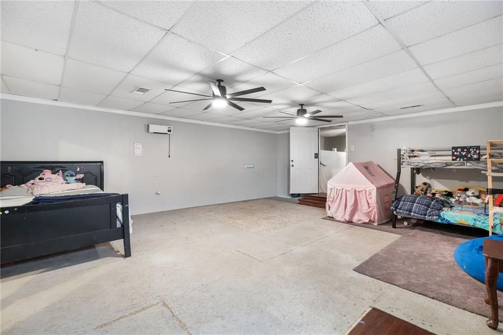 367 Benjamin Drive Rockmart, GA 30153 - Photo 17 of 34 a view of room with a baby crib and a couch