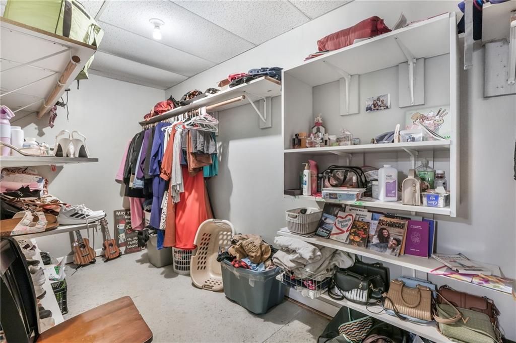 367 Benjamin Drive Rockmart, GA 30153 - Photo 19 of 34 a view of walk in closet with clothes and shoes