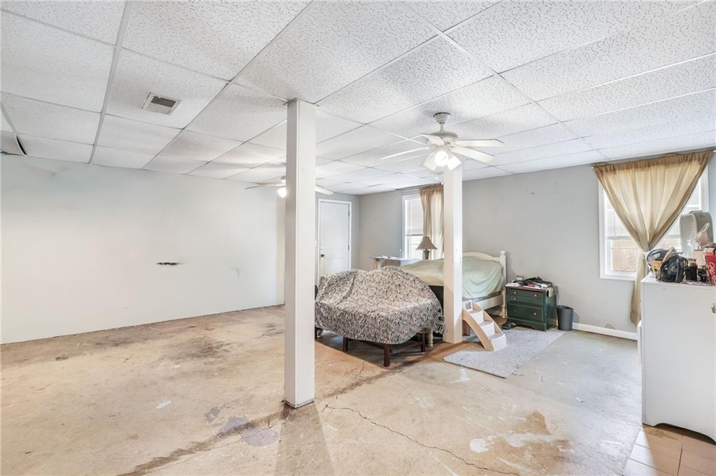 367 Benjamin Drive Rockmart, GA 30153 - Photo 20 of 34 a spacious bedroom with a bed and a chandelier