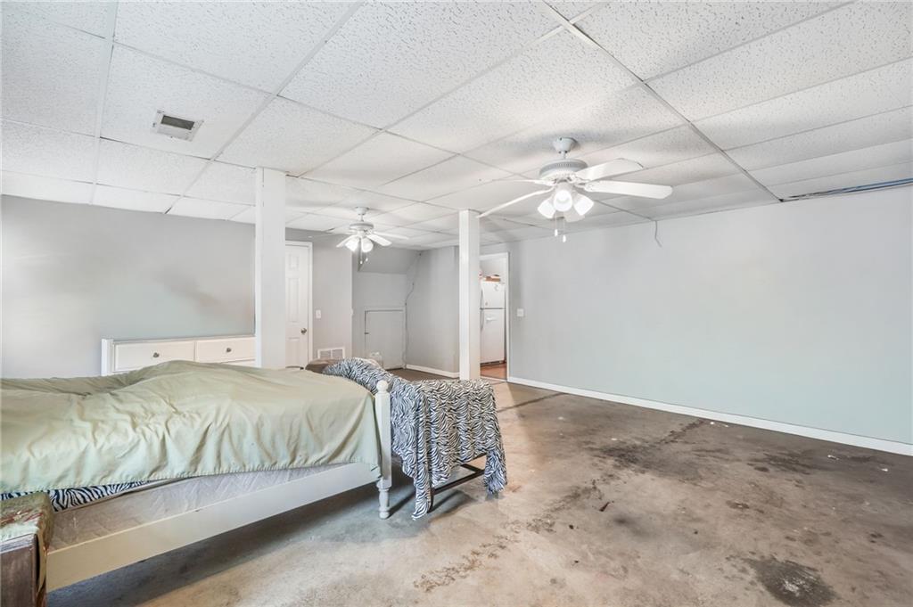 367 Benjamin Drive Rockmart, GA 30153 - Photo 21 of 34 a bedroom with a bed chandelier and a window