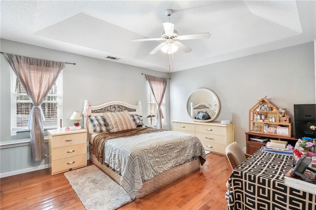 367 Benjamin Drive Rockmart, GA 30153 - Photo 25 of 34 a bedroom with a bed and a chandelier
