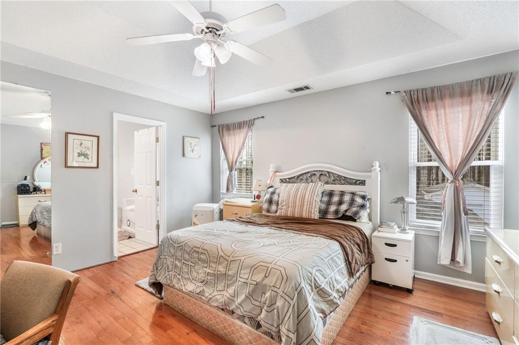 367 Benjamin Drive Rockmart, GA 30153 - Photo 26 of 34 a spacious bedroom with a bed and a chandelier