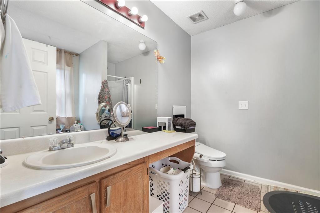 367 Benjamin Drive Rockmart, GA 30153 - Photo 27 of 34 a bathroom with a sink toilet and mirror