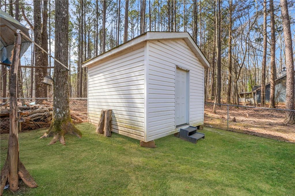367 Benjamin Drive Rockmart, GA 30153 - Photo 32 of 34 a view of backyard with a garden