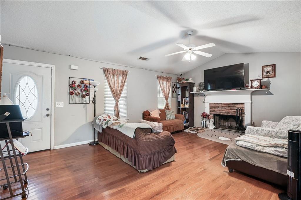 367 Benjamin Drive Rockmart, GA 30153 - Photo 7 of 34 a living room with furniture a flat screen tv and a fireplace