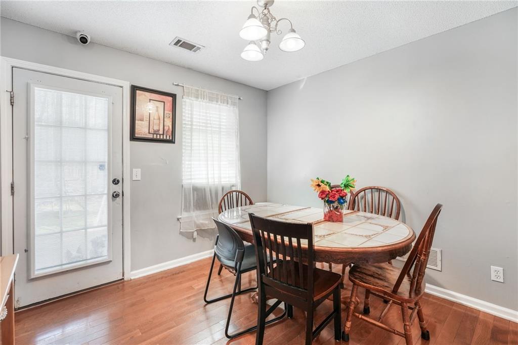 367 Benjamin Drive Rockmart, GA 30153 - Photo 10 of 34 a dining room with furniture a chandelier and wooden floor
