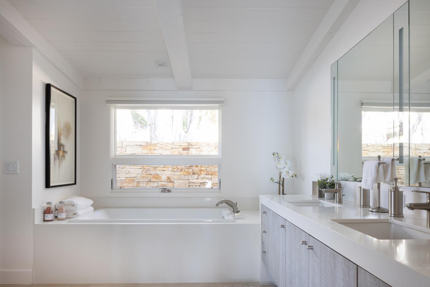 162 Spindrift Road Carmel, CA 93923 - Photo 12 of 34 a bathroom with a granite countertop sink mirror and a bathtub