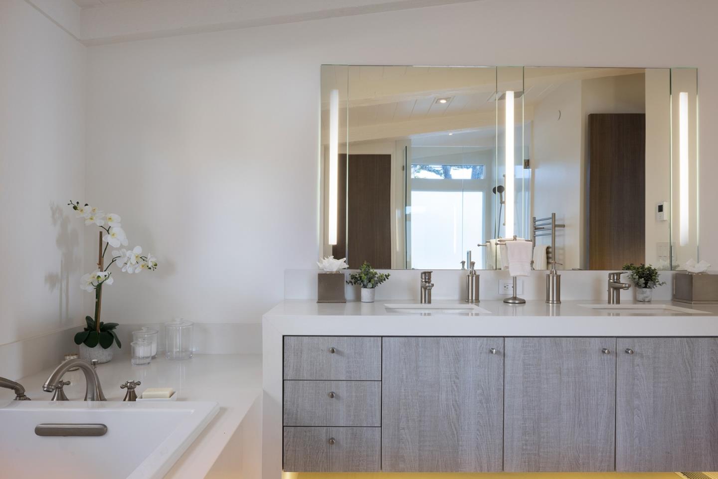 162 Spindrift Road Carmel, CA 93923 - Photo 13 of 34 a bathroom with a double vanity sink mirror and double