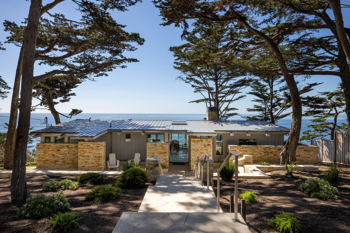 162 Spindrift Road Carmel, CA 93923 - Photo 24 of 34 a front view of a house with a garden