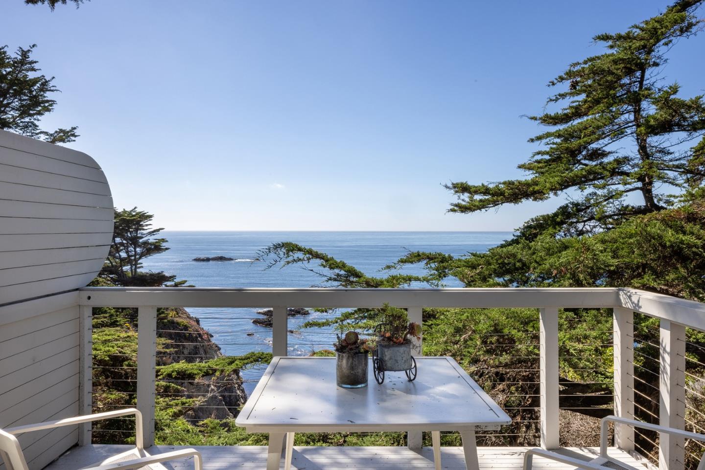 162 Spindrift Road Carmel, CA 93923 - Photo 28 of 34 a view of a balcony with chair and table