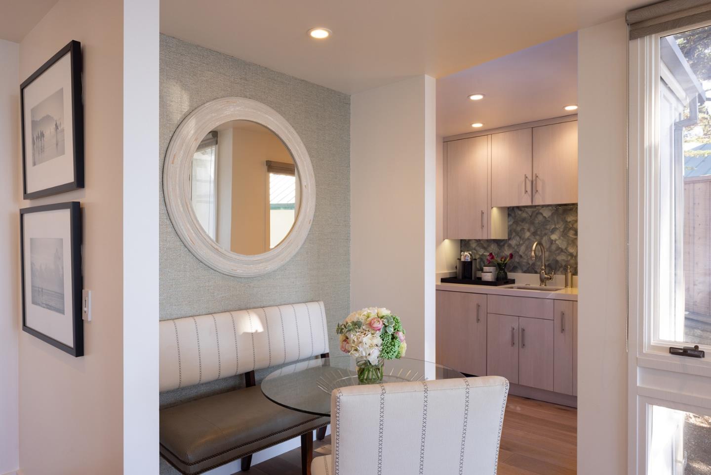 162 Spindrift Road Carmel, CA 93923 - Photo 29 of 34 a kitchen with cabinets a sink and a stove next to a window