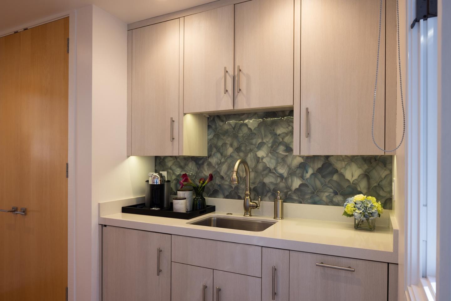 162 Spindrift Road Carmel, CA 93923 - Photo 30 of 34 a kitchen with a sink and cabinets