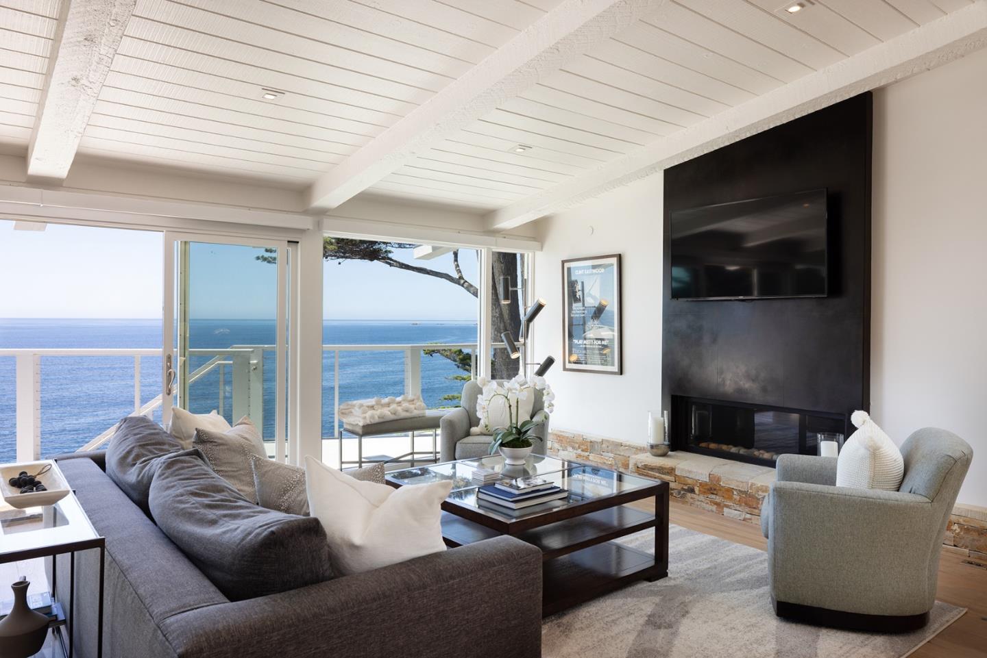 162 Spindrift Road Carmel, CA 93923 - Photo 3 of 34 a living room with furniture and a flat screen tv