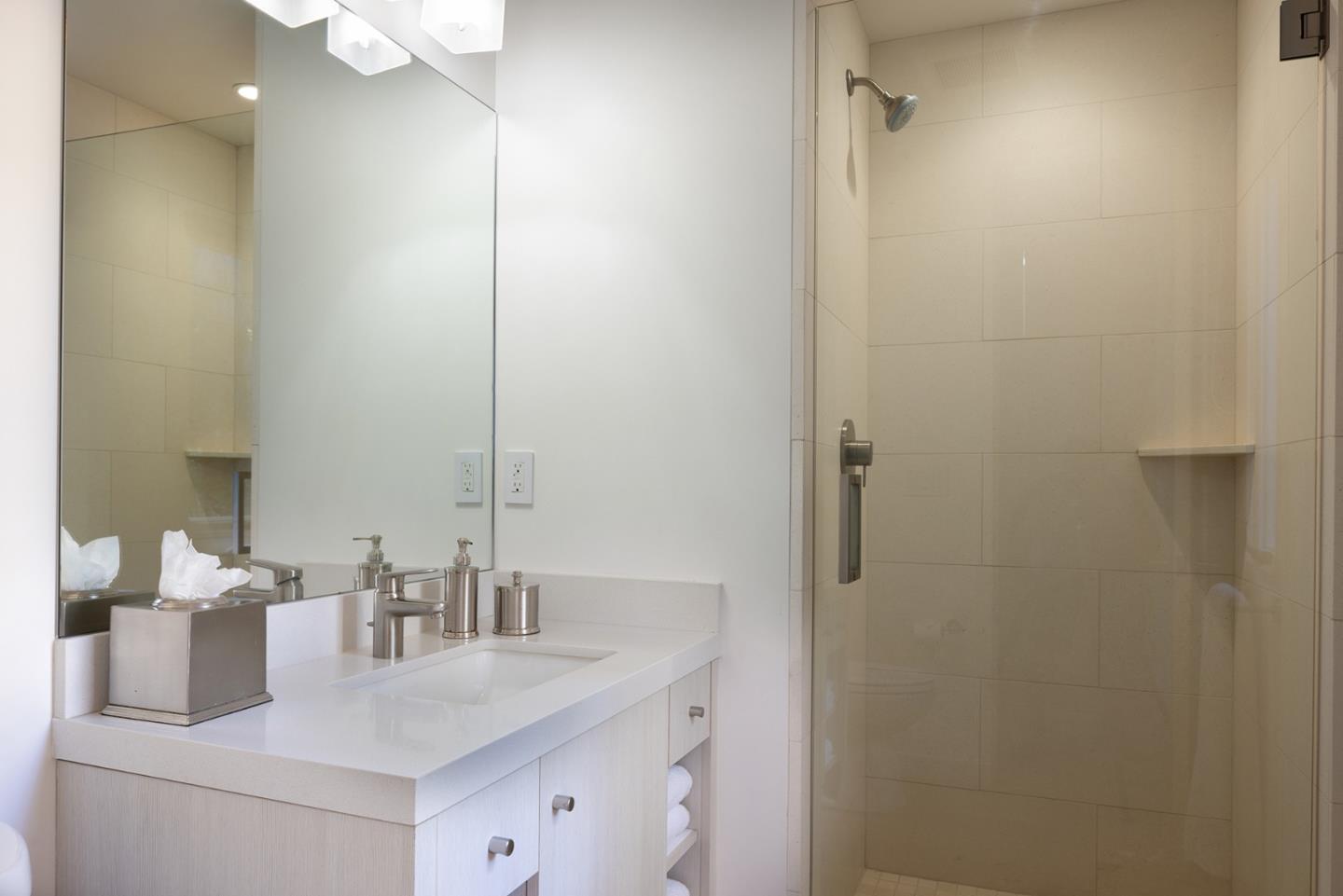 162 Spindrift Road Carmel, CA 93923 - Photo 31 of 34 a bathroom with a sink and a mirror