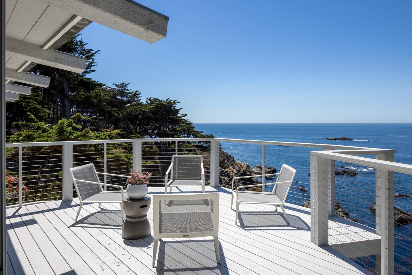 162 Spindrift Road Carmel, CA 93923 - Photo 7 of 34 a roof deck with table and chairs potted plants with wooden floor