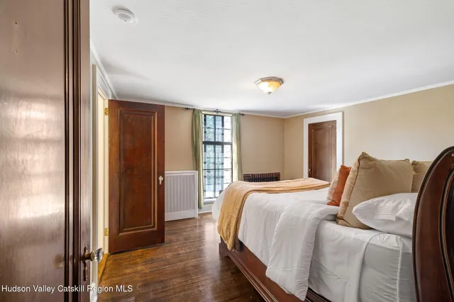 a bedroom with a bed and closet