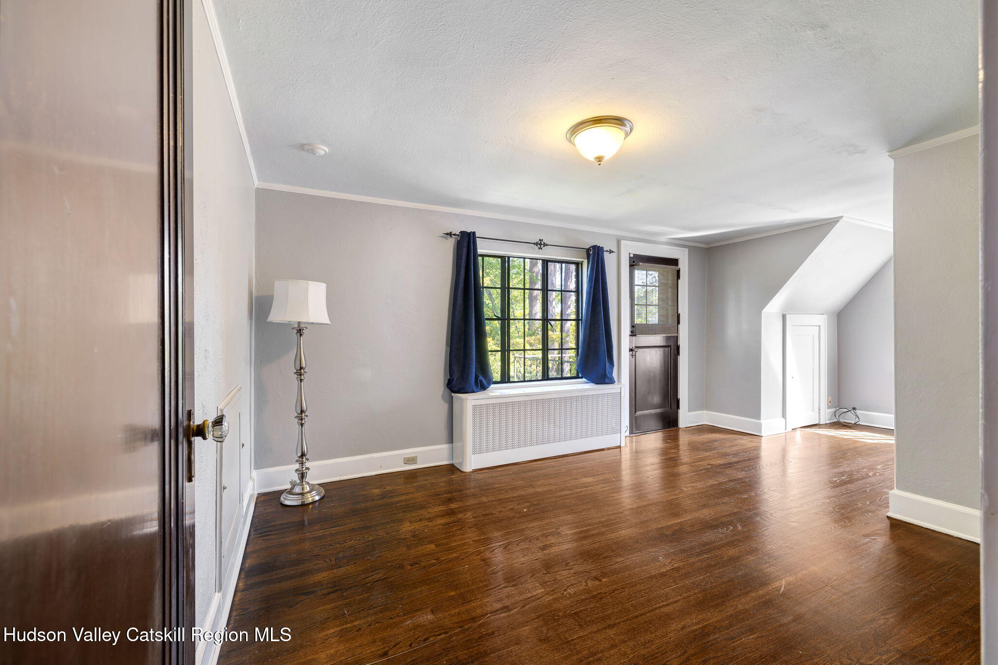 11 Seaman Road Poughkeepsie, NY 12601 - Photo 28 of 49 a view of an empty room with window and wooden floor