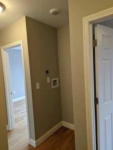 an empty room with wooden floor